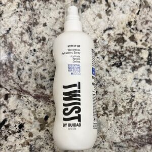 Twist by Ouidad Weightless Refreshing Spray. Essential moisture for curls.